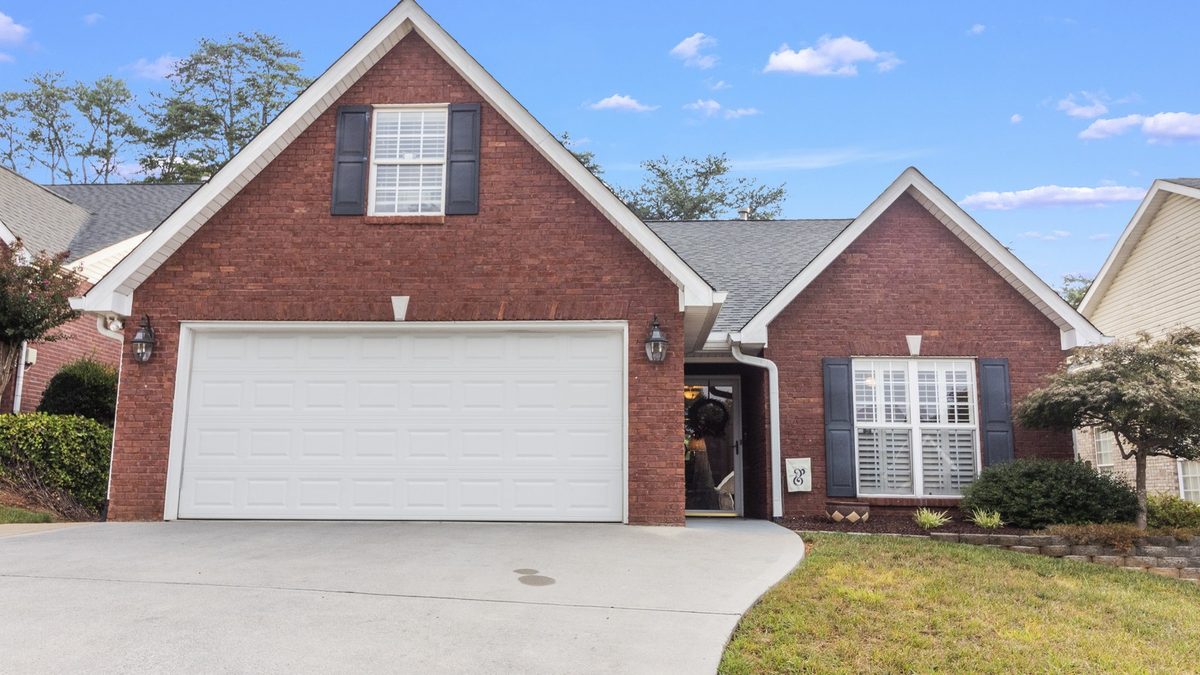 A brick traditional home with a two-car garage in an established West Knoxville family subdivision a short drive from Turkey Creek.